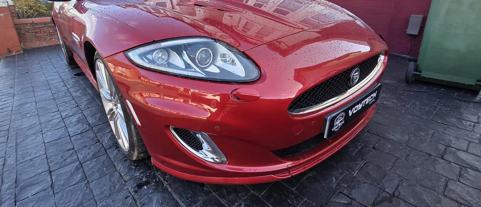 Red Jaguar XKR with a VOYTECH plate on a driveway after a Stage 1 remap