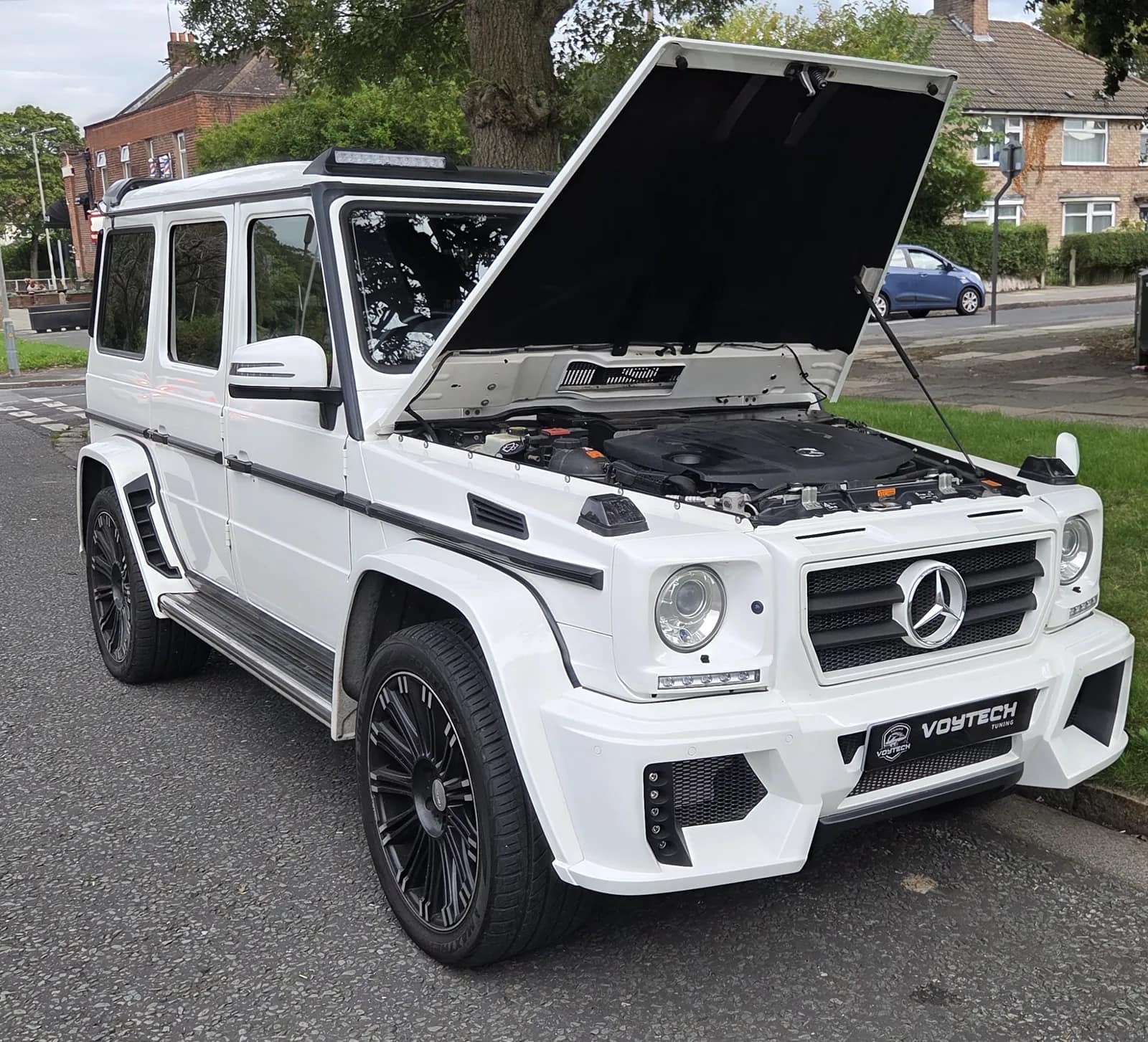 White Mercedes G-Class with the bonnet up and a VOYTECH plate