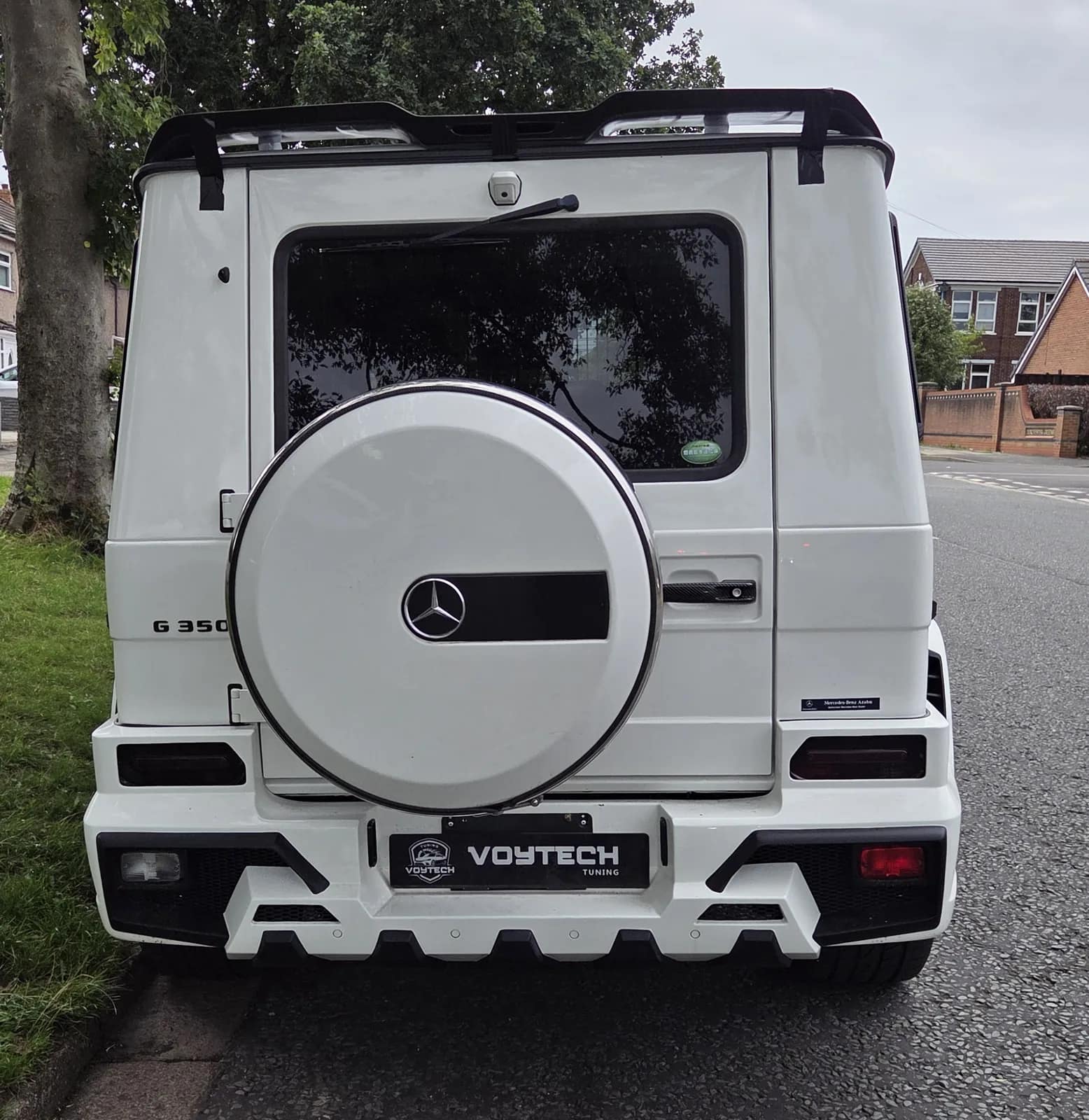 Rear of a white Mercedes G-Class with a VOYTECH plate