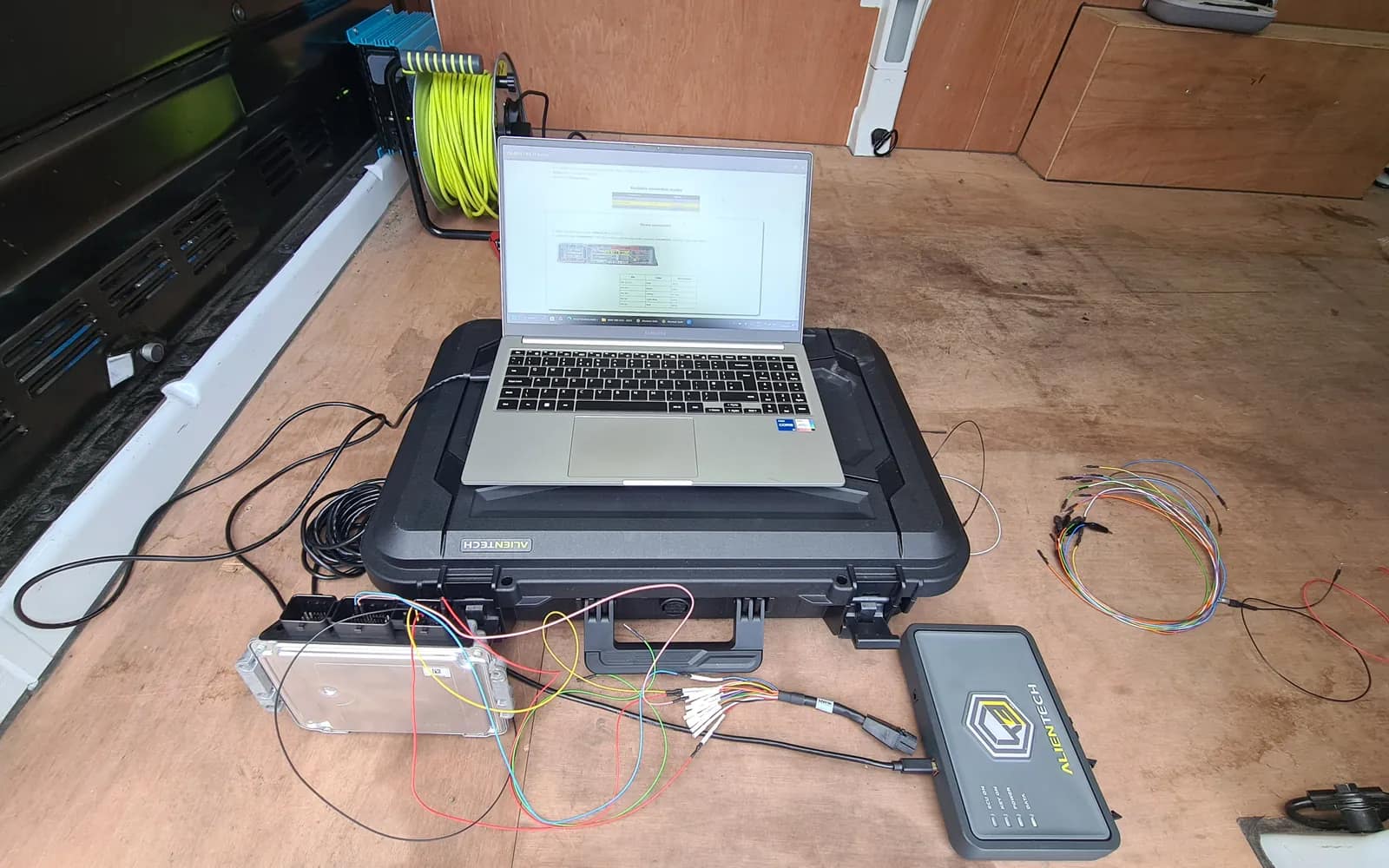 Ford Focus engine control unit wired to the tuning tool and laptop for a bench read