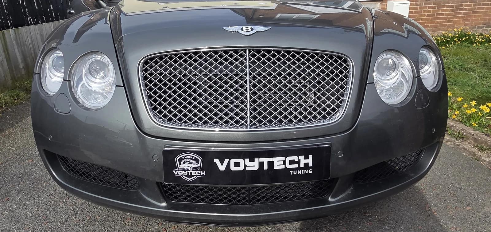 Grey Bentley Continental GT with a VOYTECH plate on a driveway after a Stage 1 remap