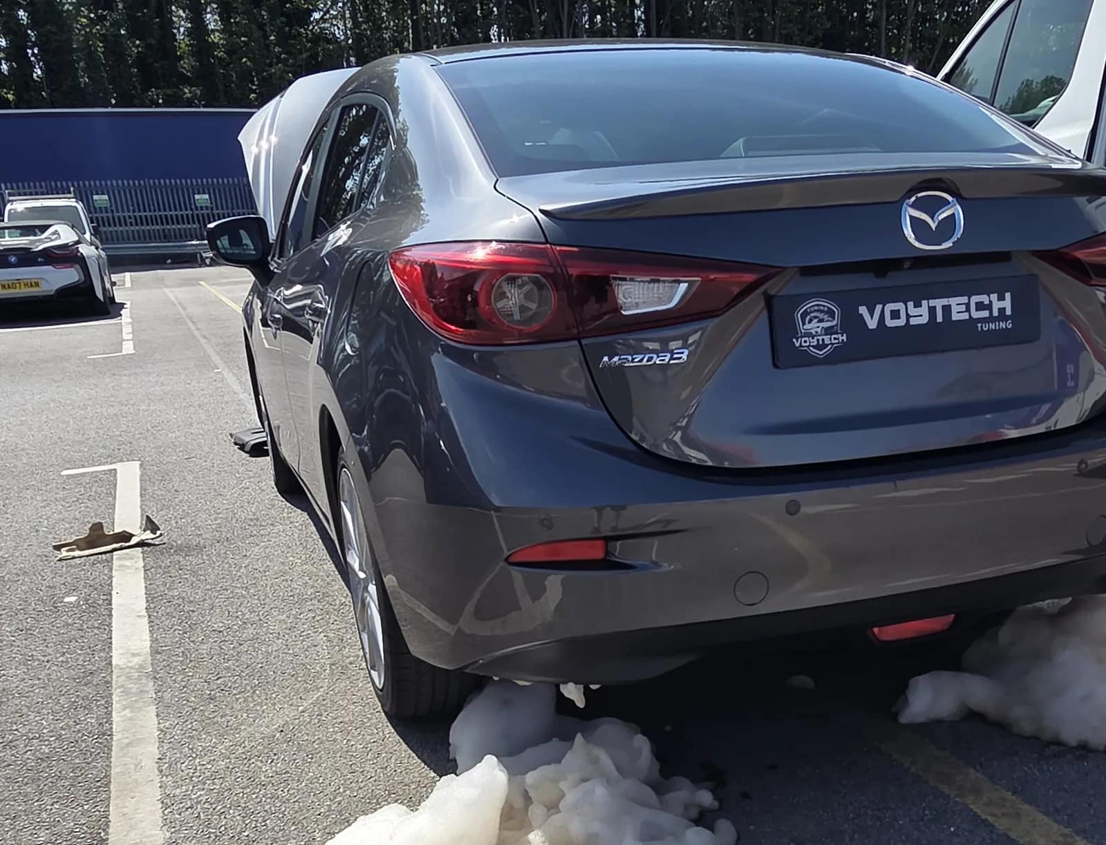 Mazda 3 with DPF cleaning foam coming out of the exhaust