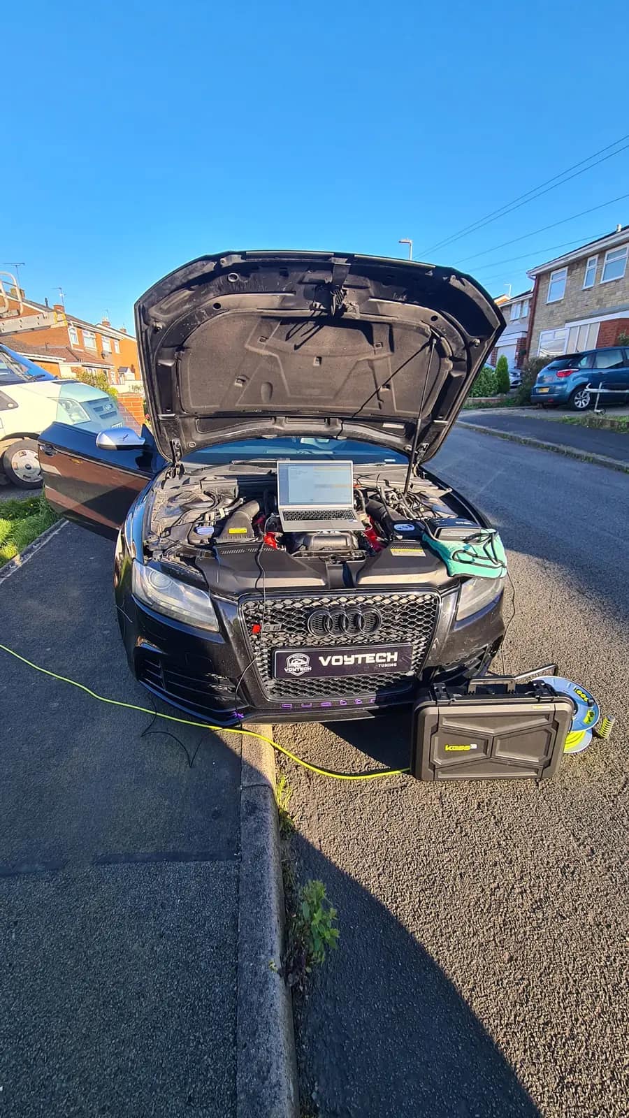 Audi with a VOYTECH plate and a laptop on the engine during a mobile remap