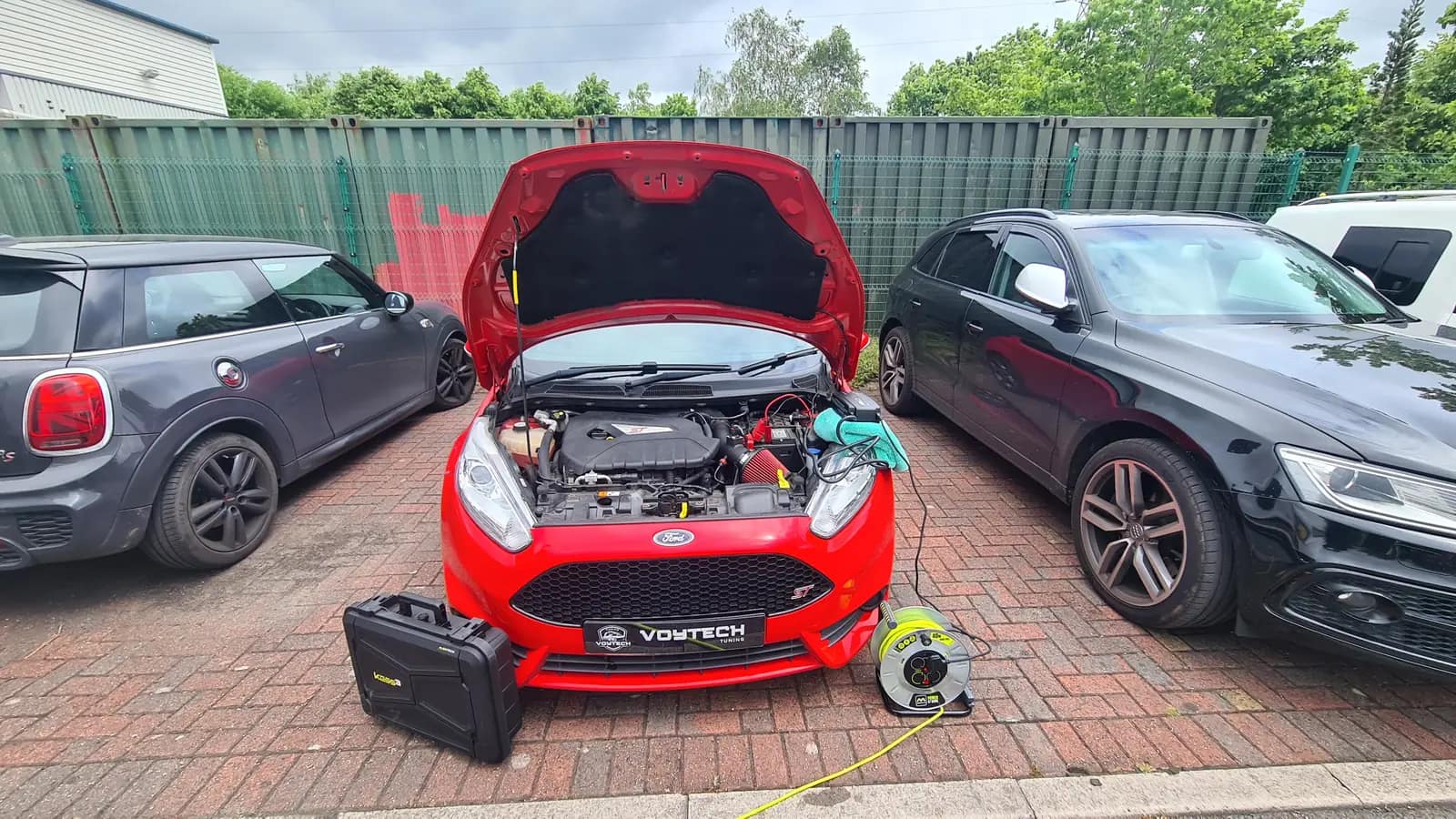 Red Ford Fiesta with a VOYTECH plate, bonnet up for a remap